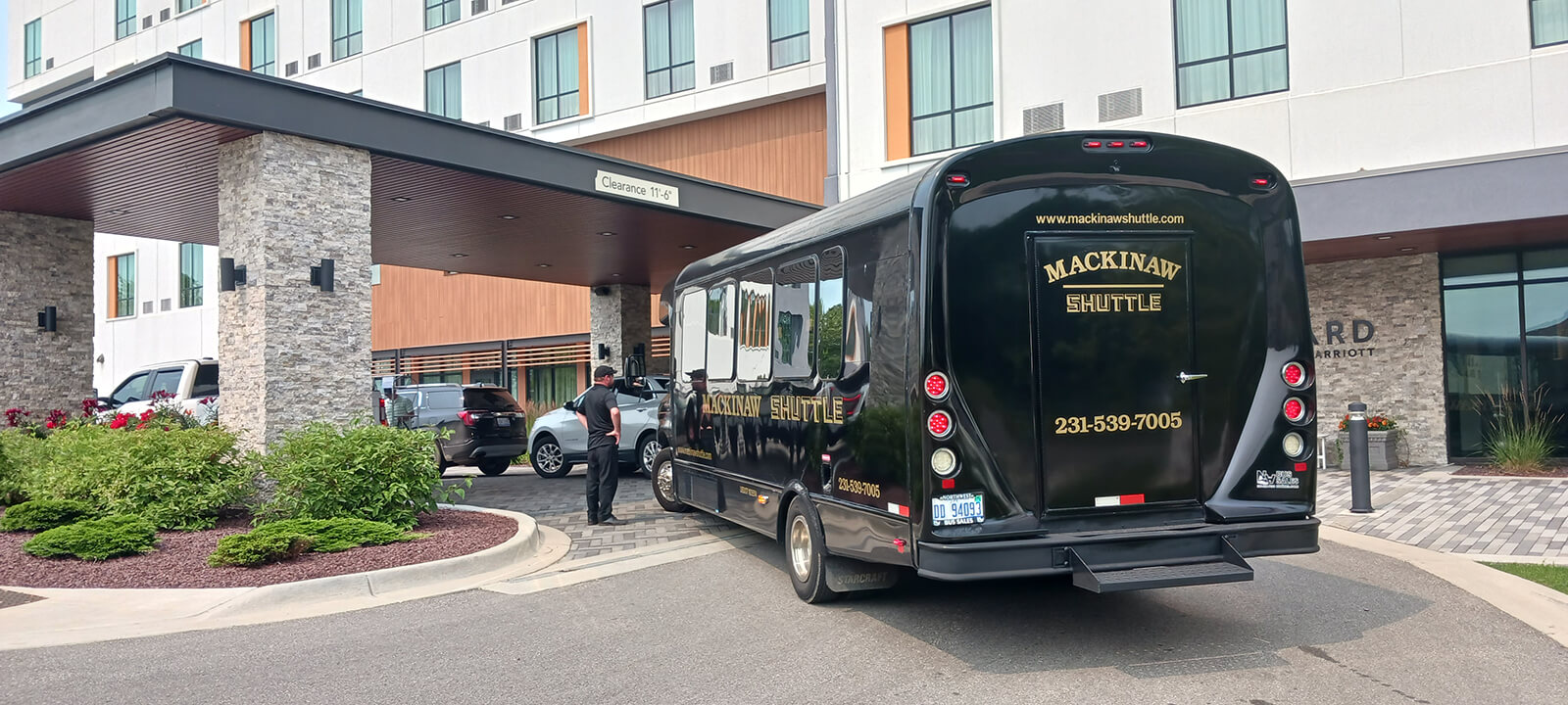 A Mackinaw Shuttle bus picking up guests at a Northern Michigan resort